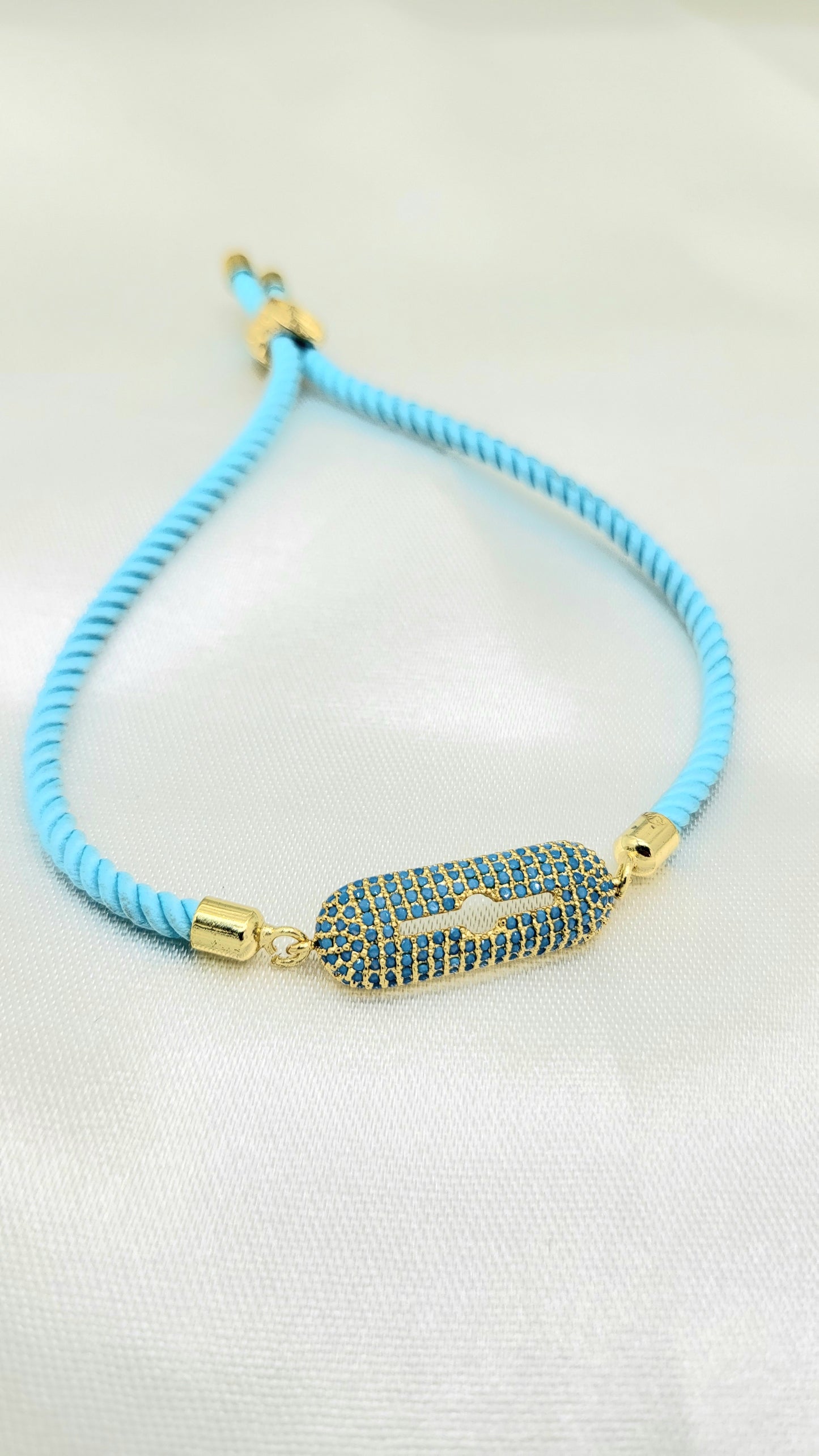 Contemporary Blue CZ Rakhi on Twisted Cord