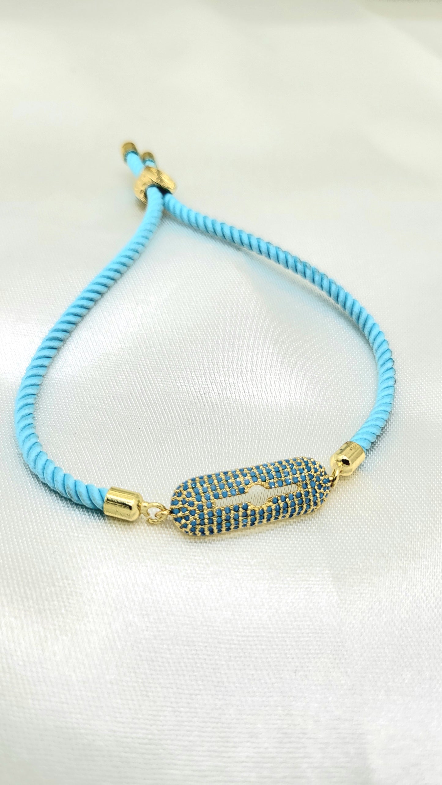 Contemporary Blue CZ Rakhi on Twisted Cord