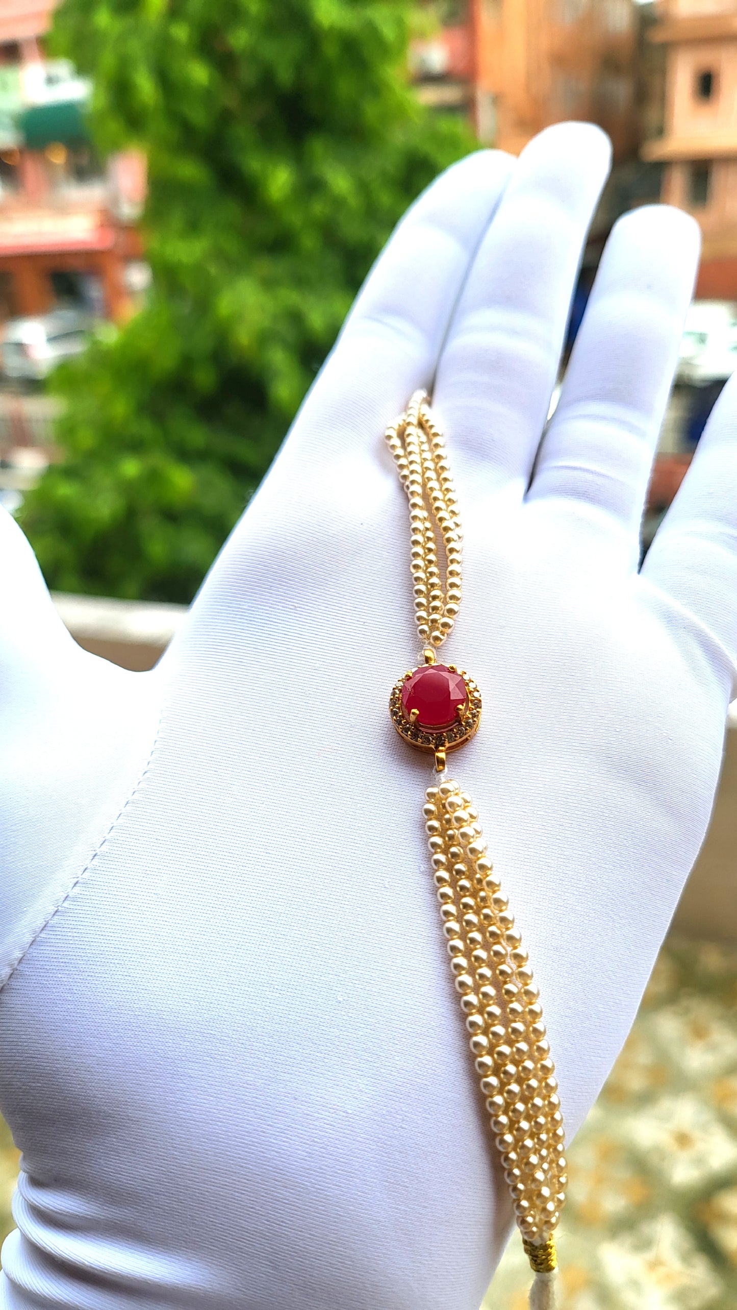 Red Stone Centerpiece Pearl Strand Bracelet