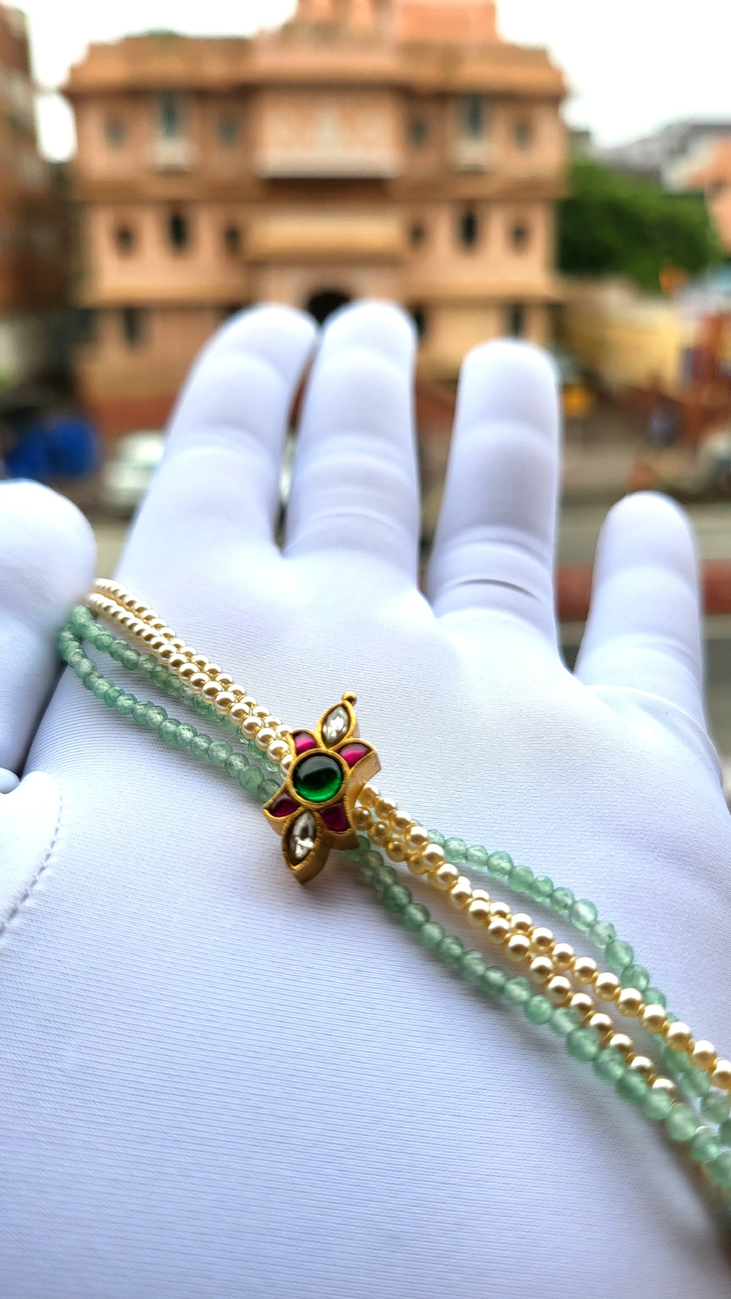 Kundan-Inspired Floral Bracelet with Green Beads & Pearl Strands