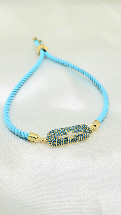 Contemporary Blue CZ Rakhi on Twisted Cord