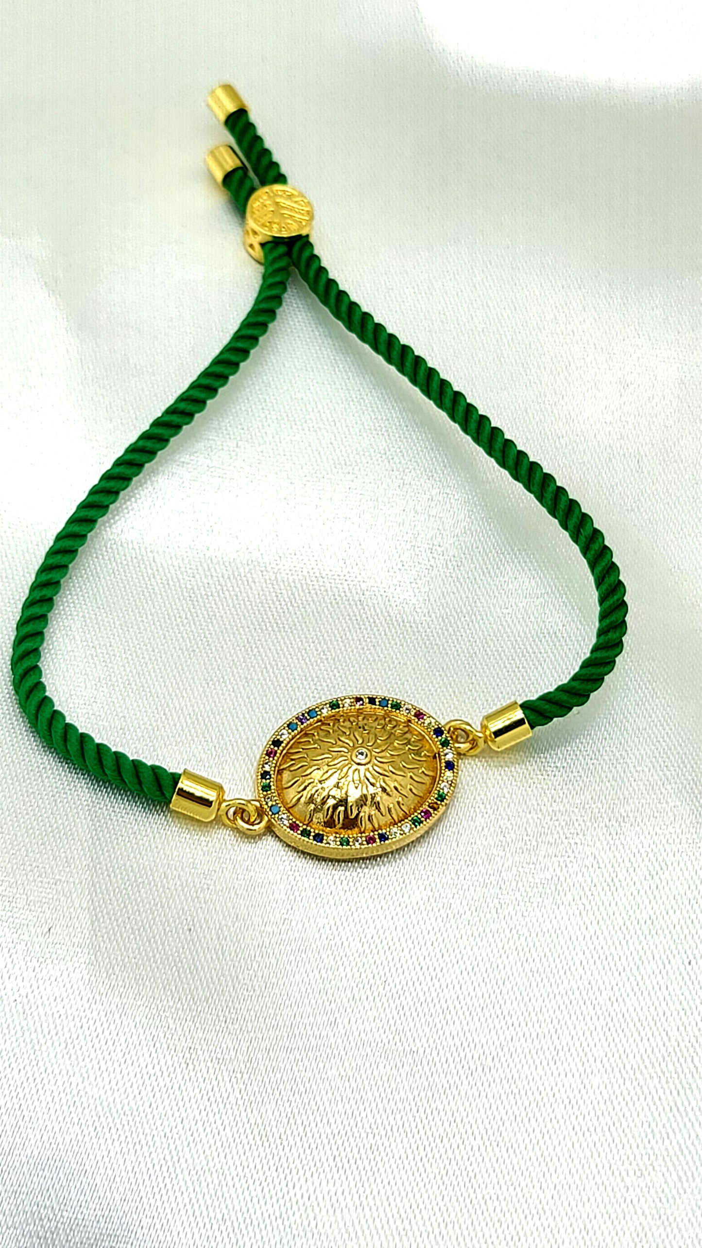Royal Emblem Rakhi with Multicolor Accents – Green Cord