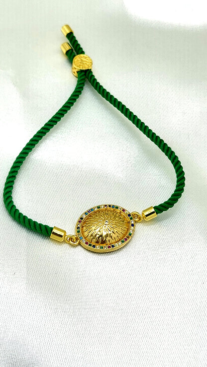 Royal Emblem Rakhi with Multicolor Accents – Green Cord