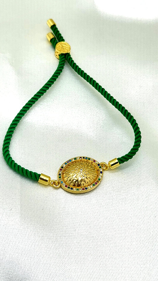 Royal Emblem Rakhi with Multicolor Accents – Green Cord