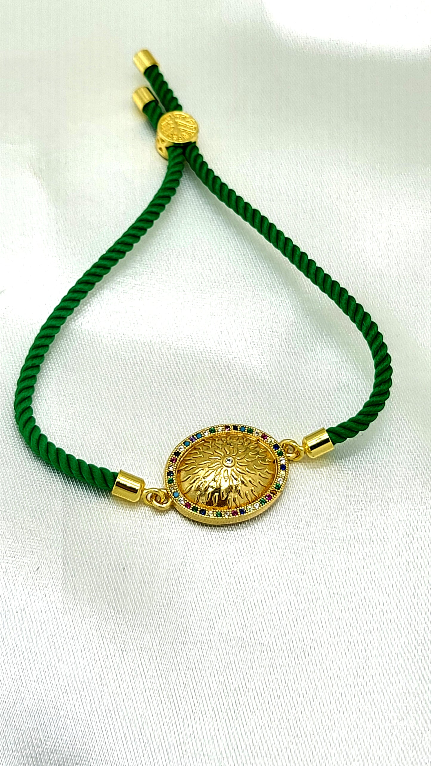 Royal Emblem Rakhi with Multicolor Accents – Green Cord