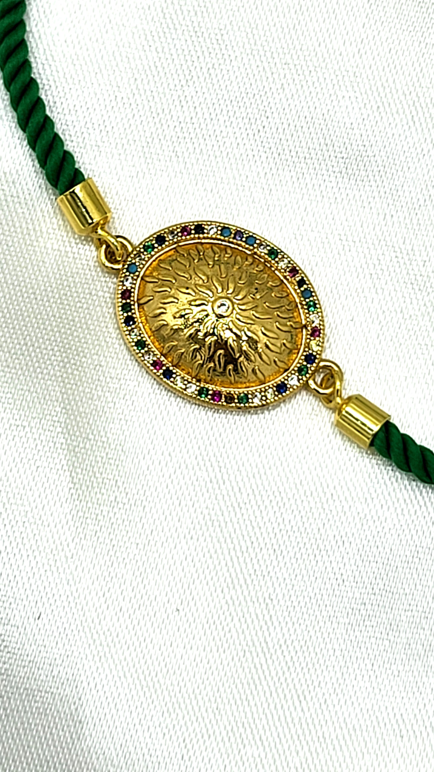 Royal Emblem Rakhi with Multicolor Accents – Green Cord
