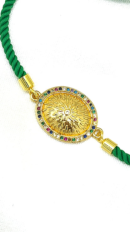 Royal Emblem Rakhi with Multicolor Accents – Green Cord