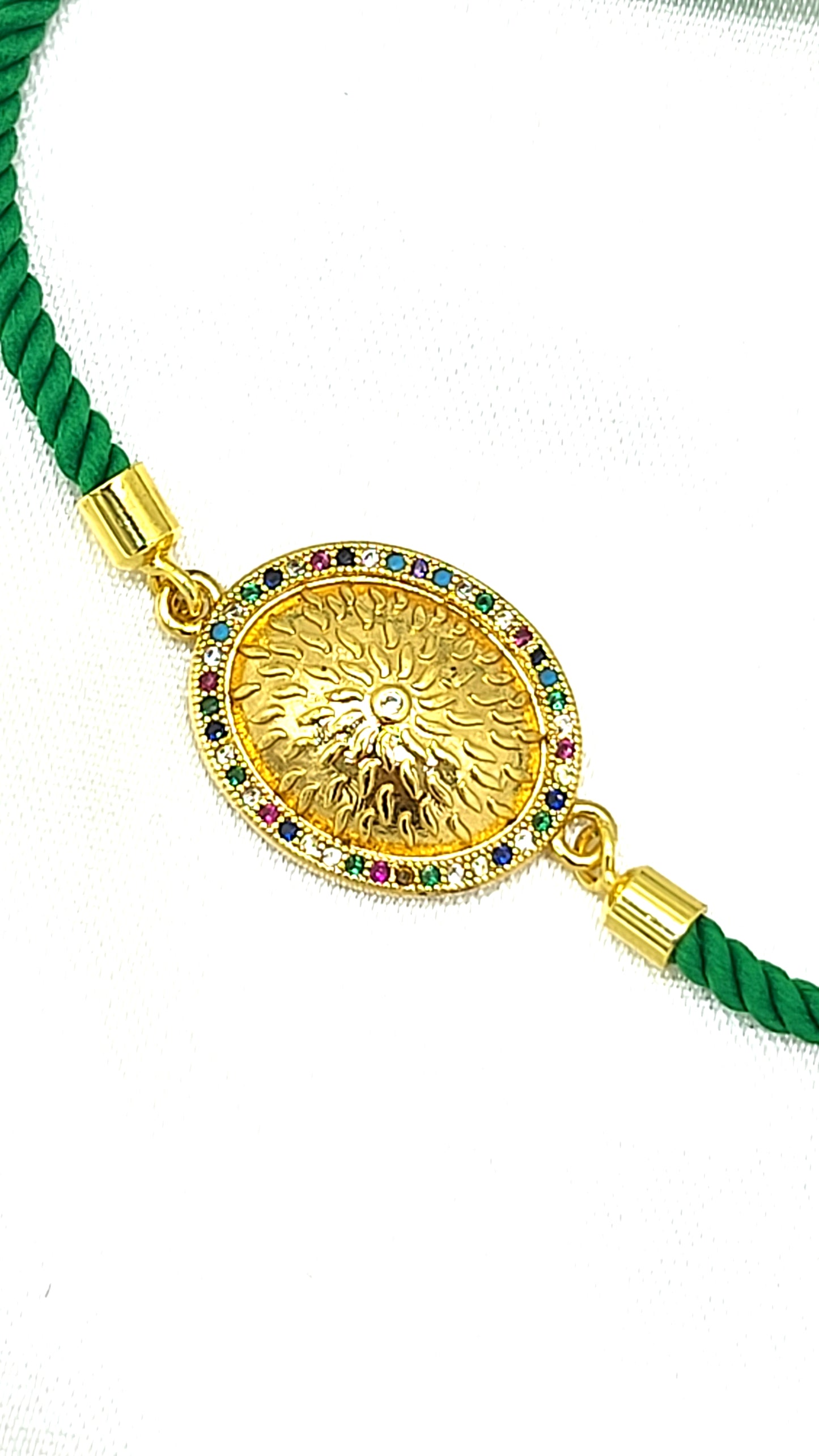 Royal Emblem Rakhi with Multicolor Accents – Green Cord