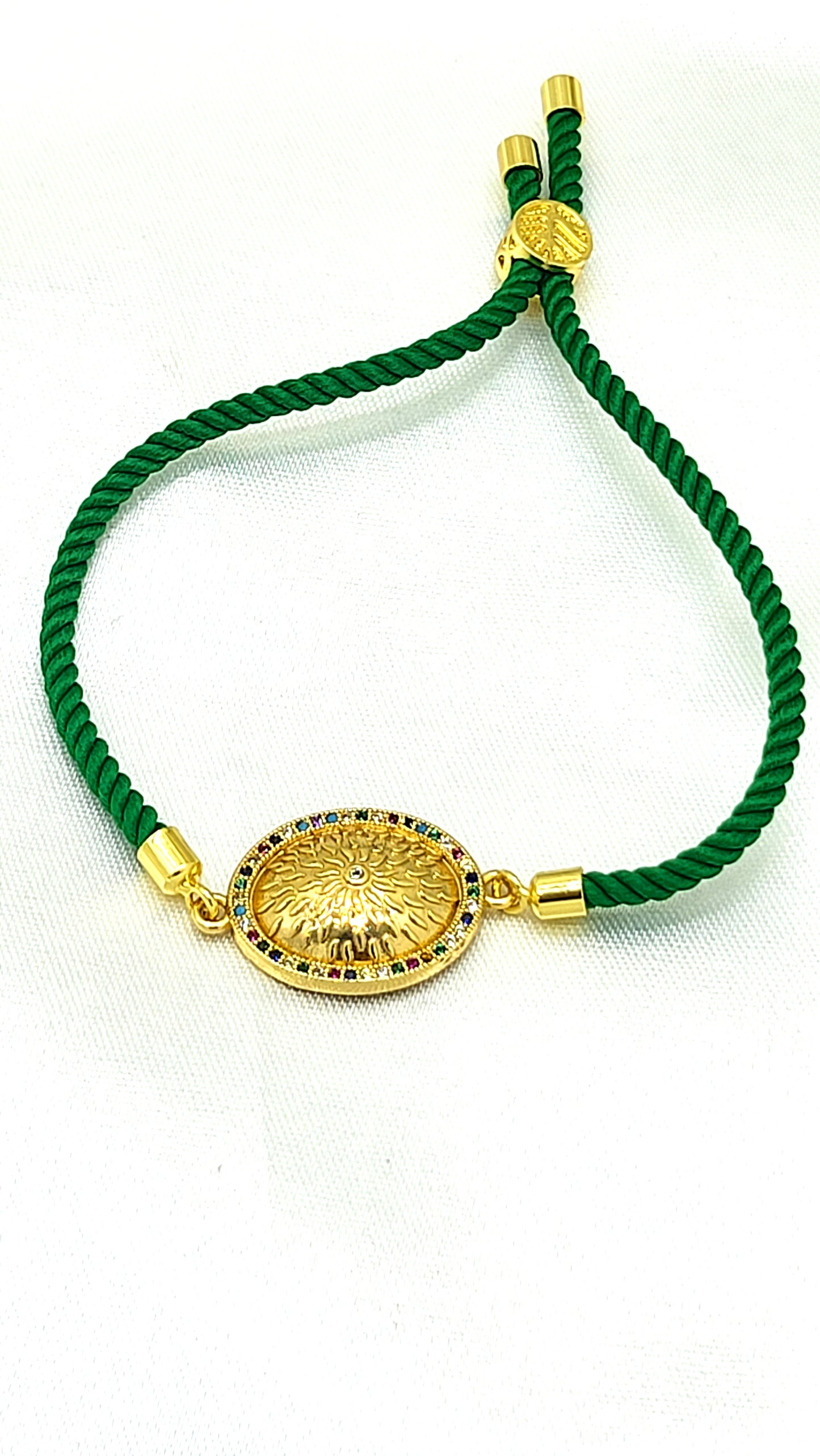 Royal Emblem Rakhi with Multicolor Accents – Green Cord