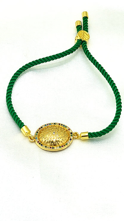 Royal Emblem Rakhi with Multicolor Accents – Green Cord