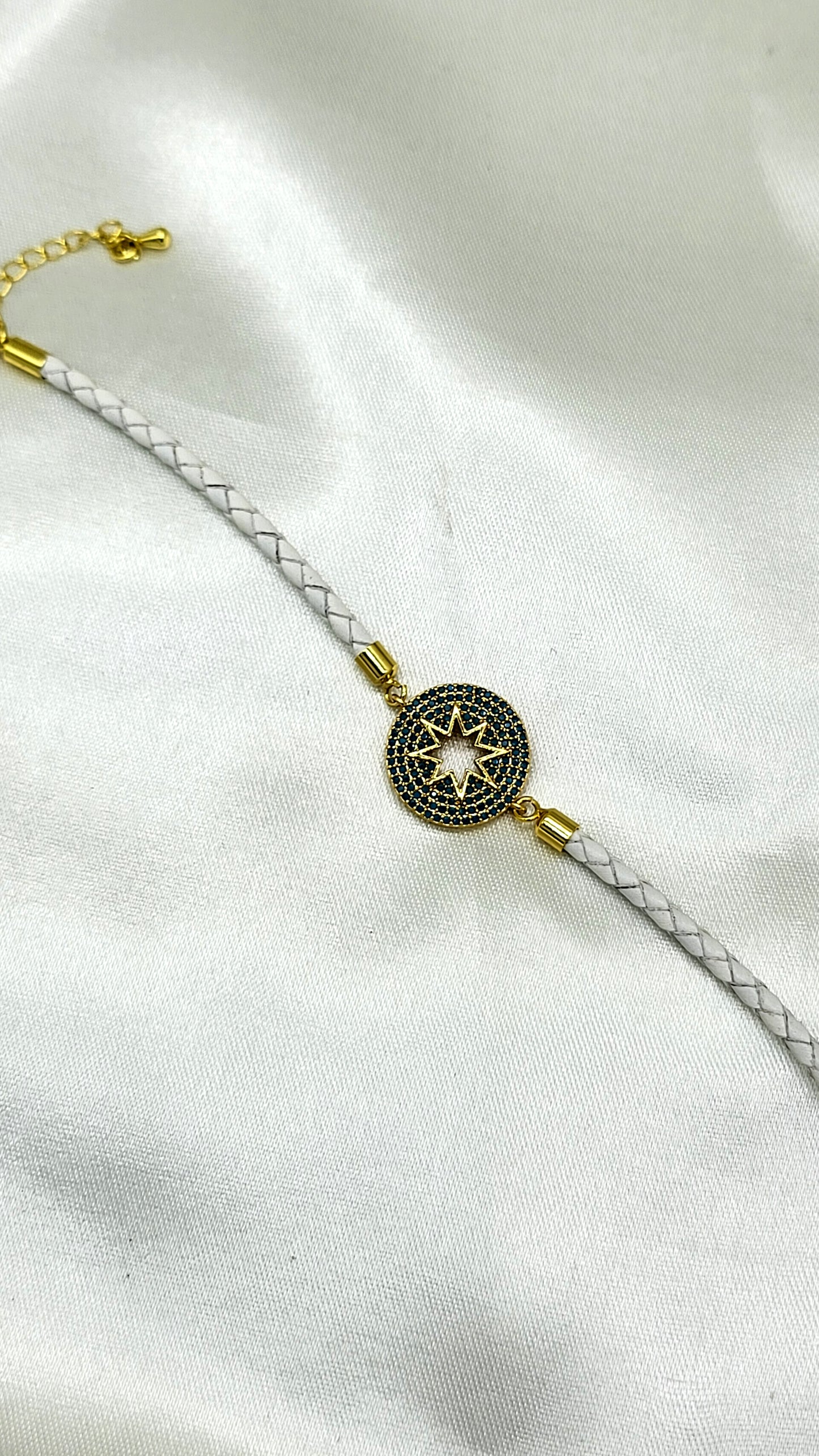 North Star CZ Rakhi on White Braided Cord