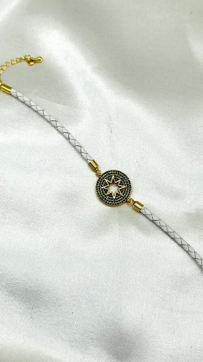 North Star CZ Rakhi on White Braided Cord