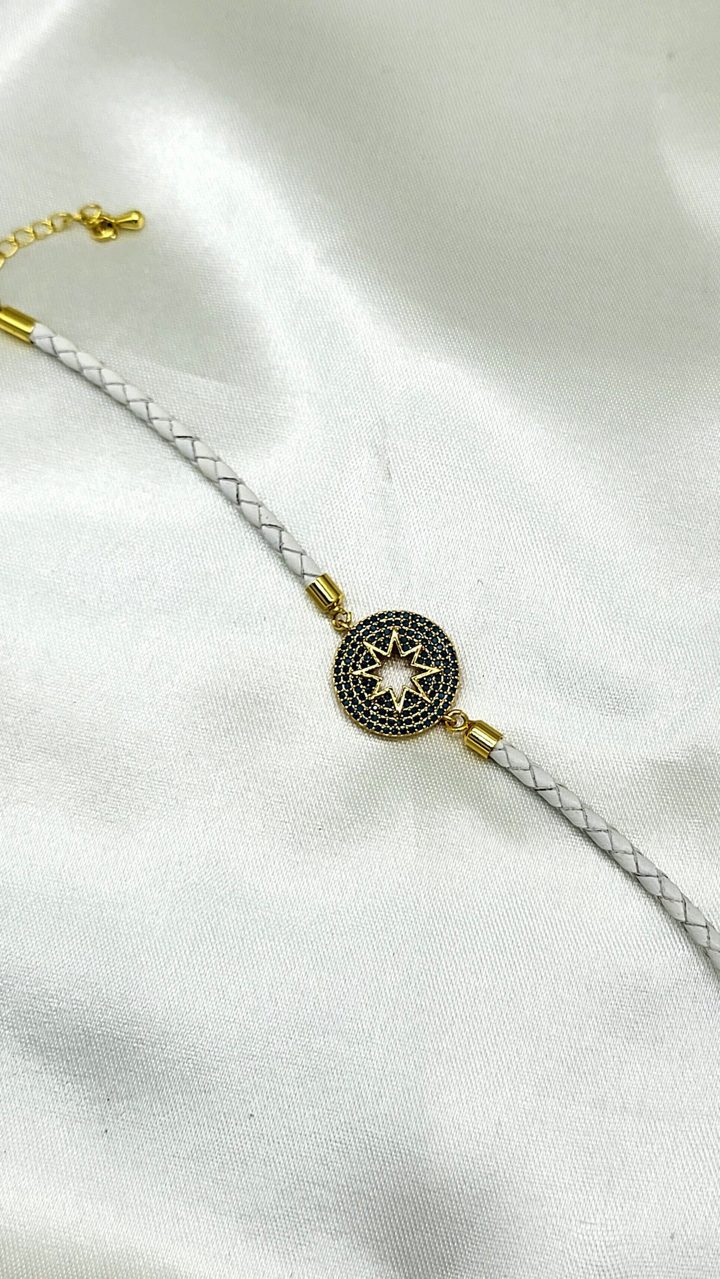 North Star CZ Rakhi on White Braided Cord