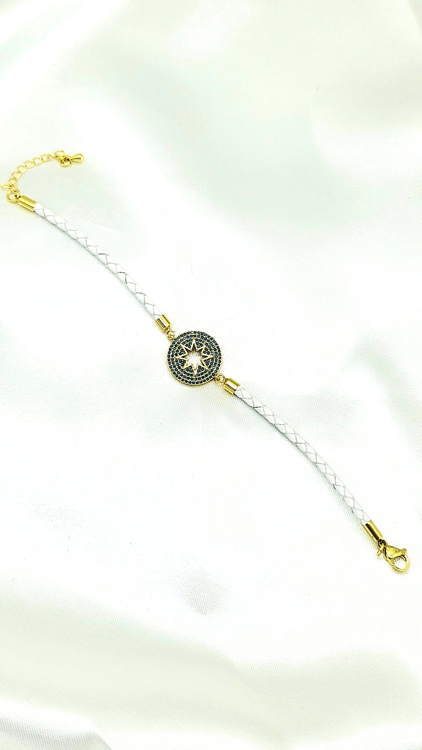 North Star CZ Rakhi on White Braided Cord