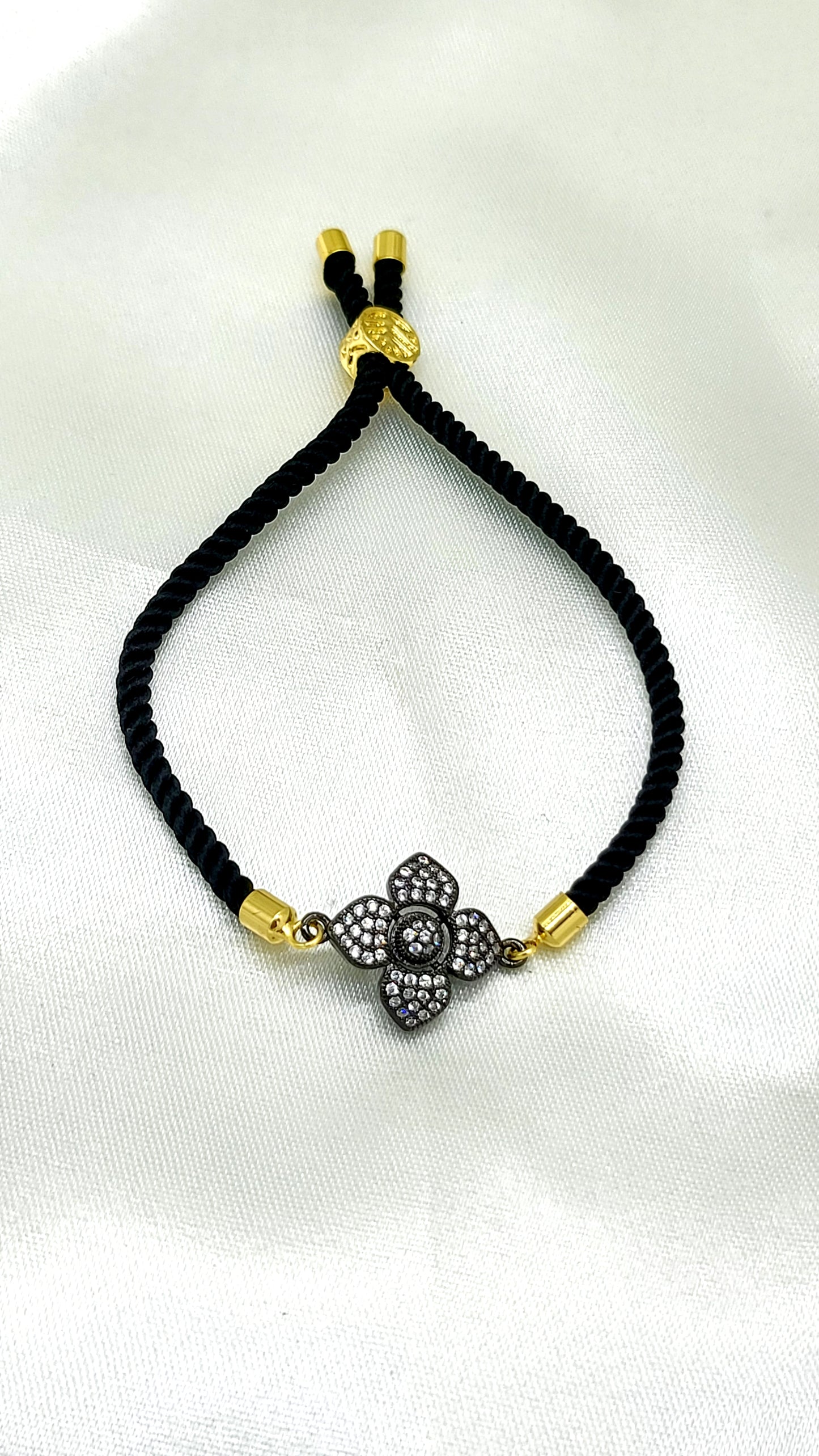 Elegant Black Rakhi with Sparkling CZ Flower