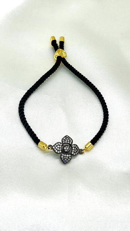 Elegant Black Rakhi with Sparkling CZ Flower