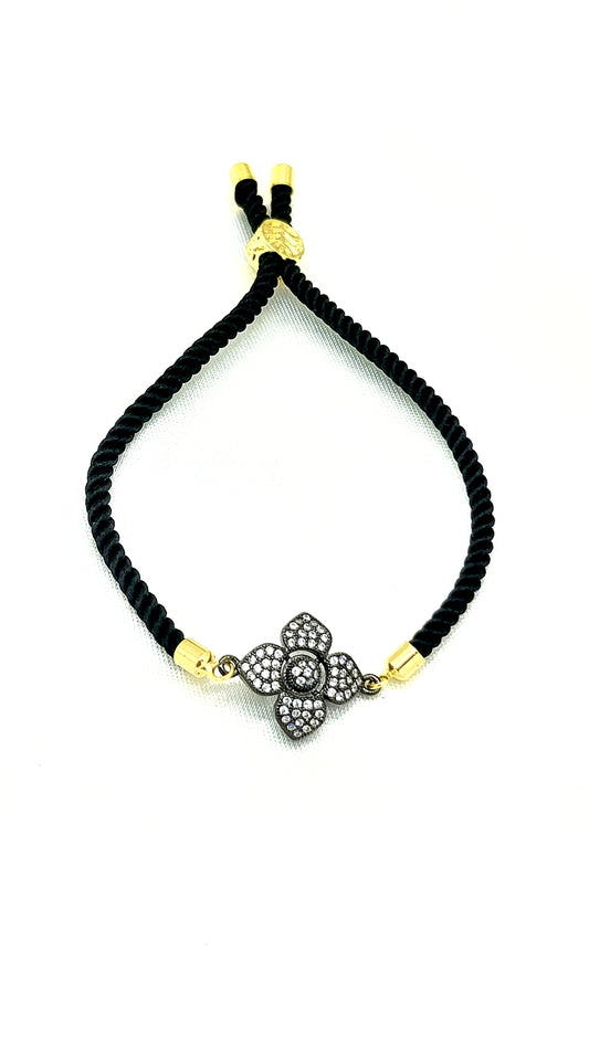 Elegant Black Rakhi with Sparkling CZ Flower