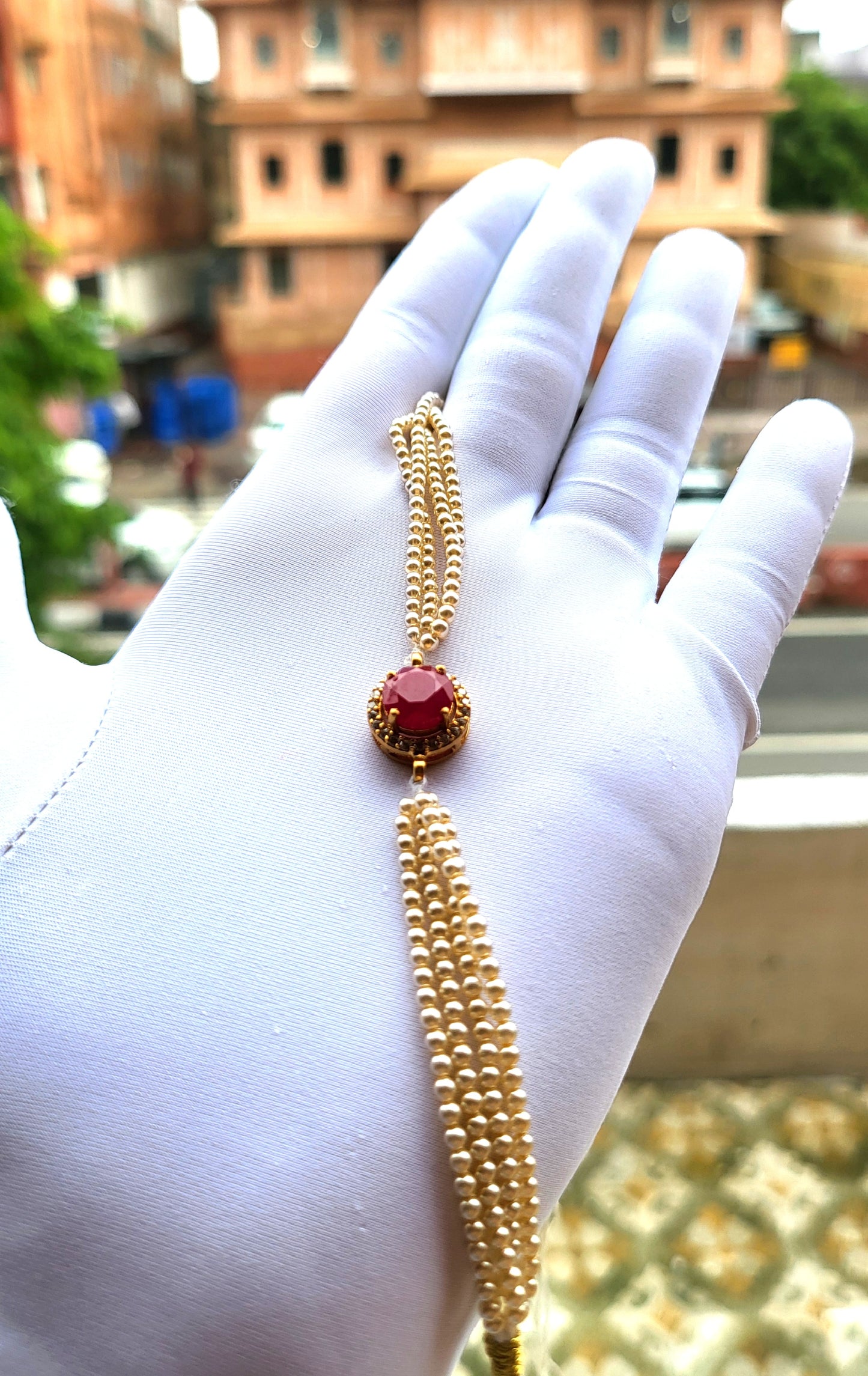 Red Stone Centerpiece Pearl Strand Bracelet