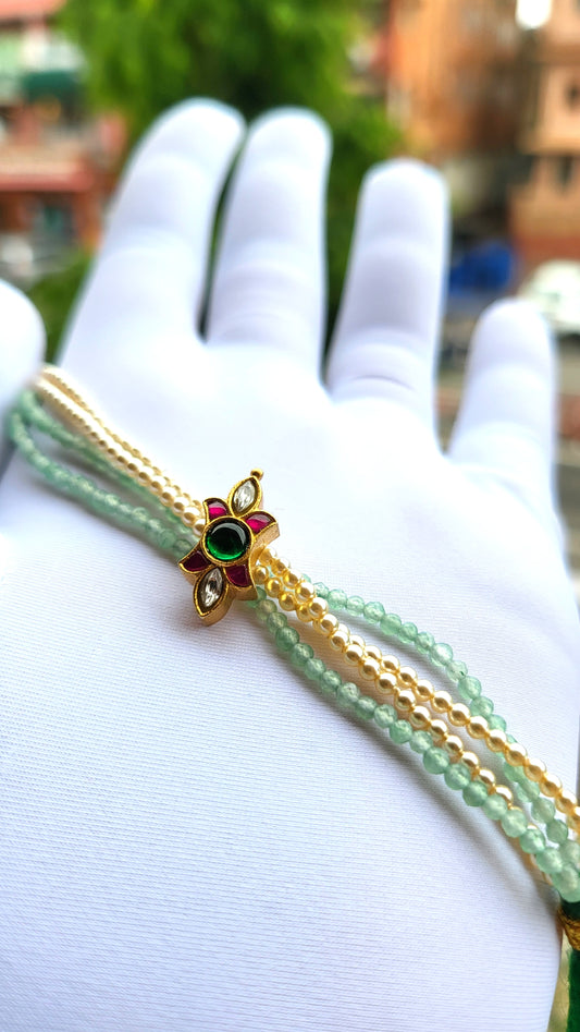 Kundan-Inspired Floral Bracelet with Green Beads & Pearl Strands